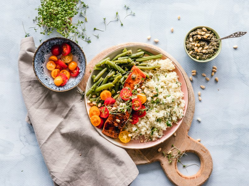 Plated meal with vegetables, grains and a grilled fillet